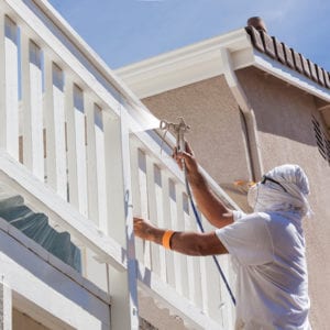 Man painting a hand rail